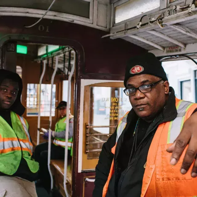 Ellis Cato and his son on a cable car.